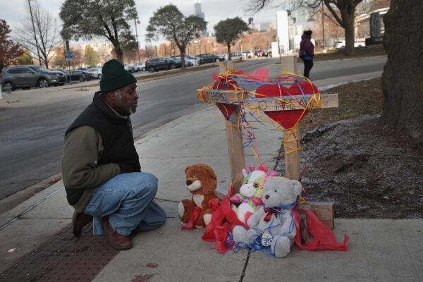 Ziff Sistrunk, of Crosses for the Losses, places crosses outside of Mercy Hospital where four people were shot and killed in Chicago, Ill., on Nov. 20, 2018. (Scott Olson/Getty Images)