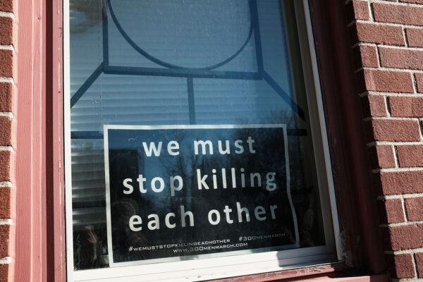 A sign to end violence sits in a window in a neighborhood with a high murder rate in Baltimore, Md., on Feb. 3, 2018. (Spencer Platt/Getty Images)