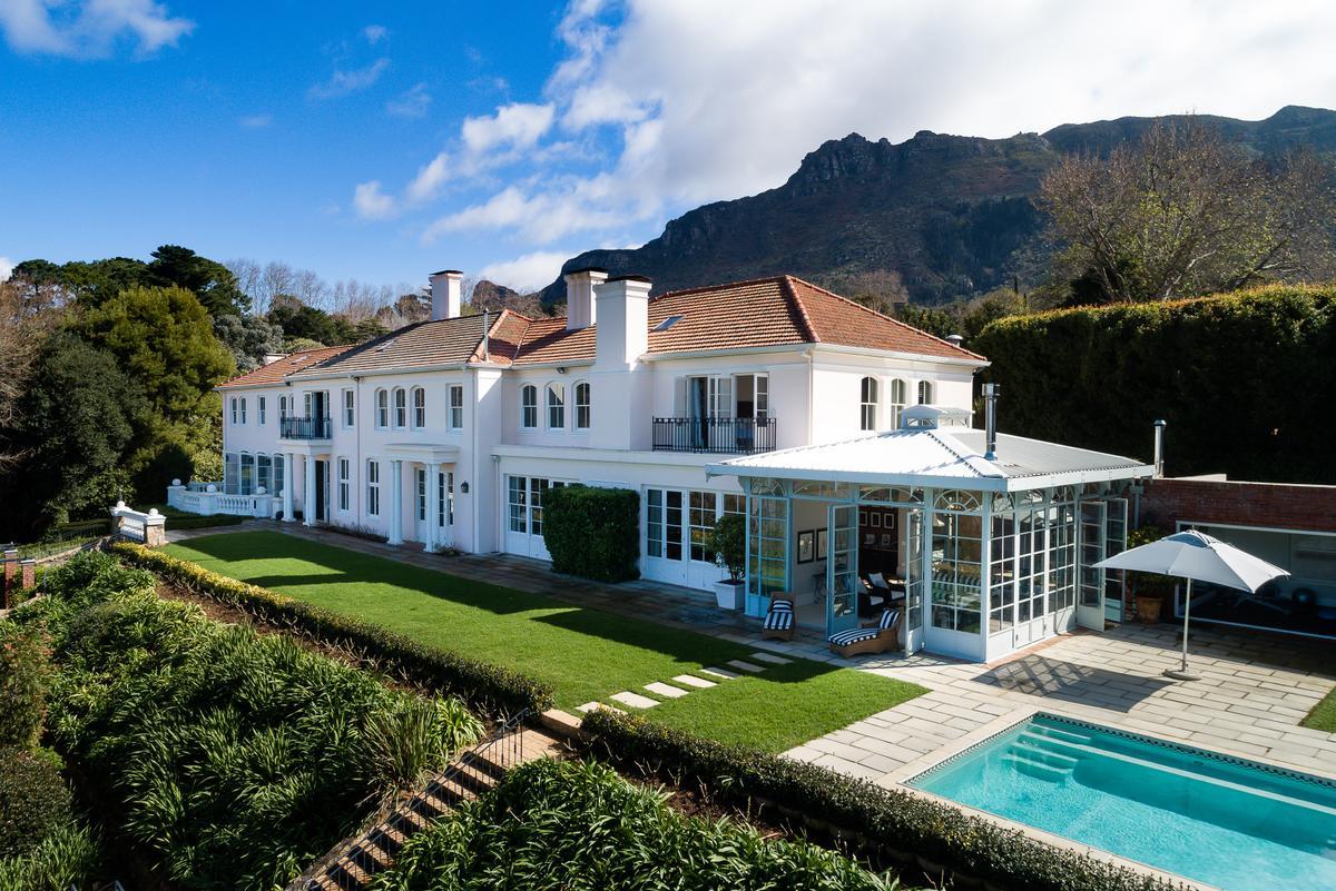 Tucked in between Table Mountain National Park, and the Constantiaberg Range, Constantia is the oldest winemaking region in the Southern Hemisphere. This extraordinary traditional estate is close to the mother city of South Africa, and away from it all at the same time. (Greef Christie’s International Real Estate)