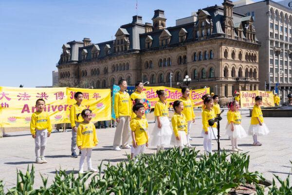 Young Falun Gong adherents perform at Parliament Hill in Ottawa on May 10, 2022. (Evan Ning/The Epoch Times)