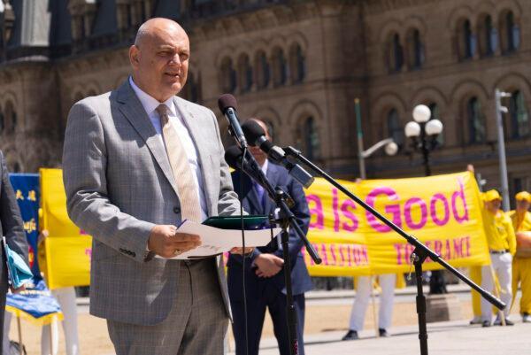 Conservative MP Larry Brock speaks during a rally in Ottawa where members of Falun Gong community celebrate the 30th anniversary of the spread of the spiritual practice on May 7, 2022. (Evan Ning/The Epoch Times)