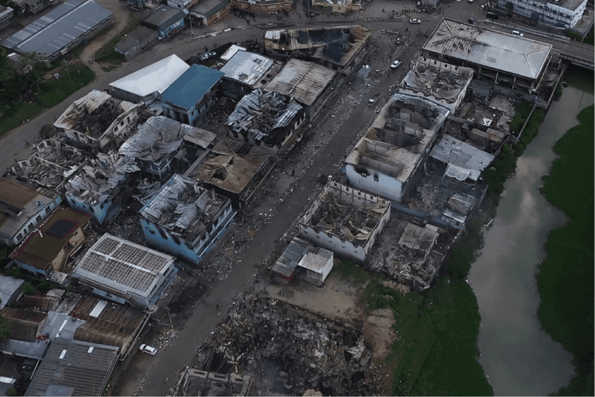 An aerial view shows burnt-out buildings in Honiara's Chinatown on Nov. 27, 2021, after calm returned to the Solomon Islands' capital after days of rioting left at least three dead and reduced sections of the city to smoldering ruins. (Jay Lioafasi/AFP via Getty Images)