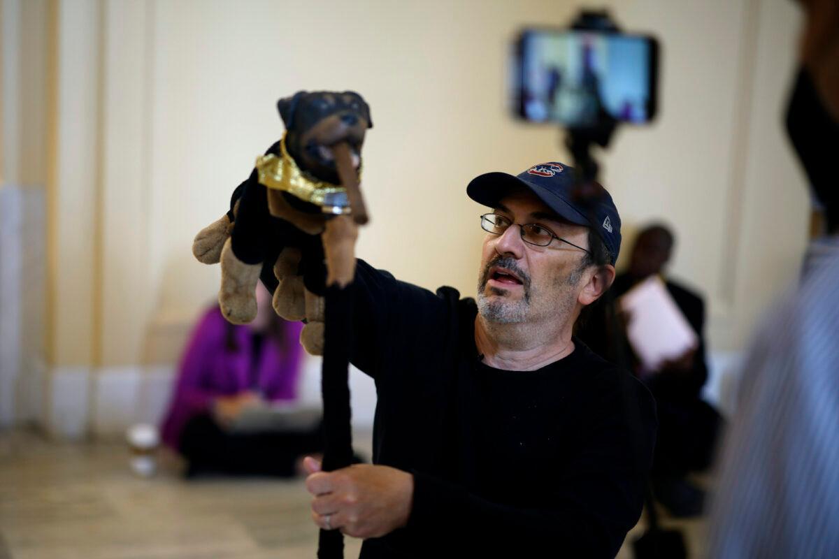 Actor and comedian Robert Smigel performs as Triumph the Insult Comic Dog in the hallways outside the House Jan. 6 Select Committee in the Cannon House Office Building in Washington on June 16, 2022 (Chip Somodevilla/Getty Images)