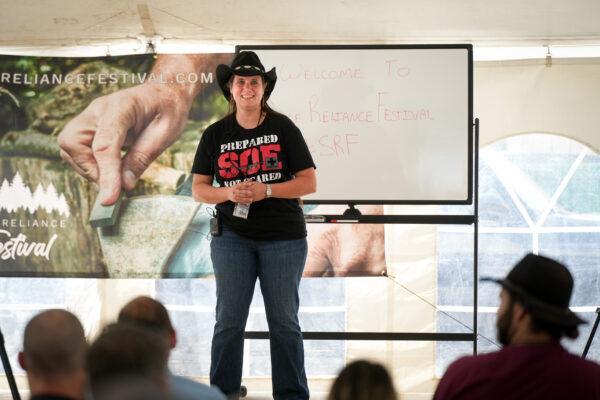 Nicole Sauce, of Living Free in Tennessee, speaks at the Self-Reliance Festival in Camden, Tenn., on June 11, 2022. (Charlotte Cuthbertson/The Epoch Times)
