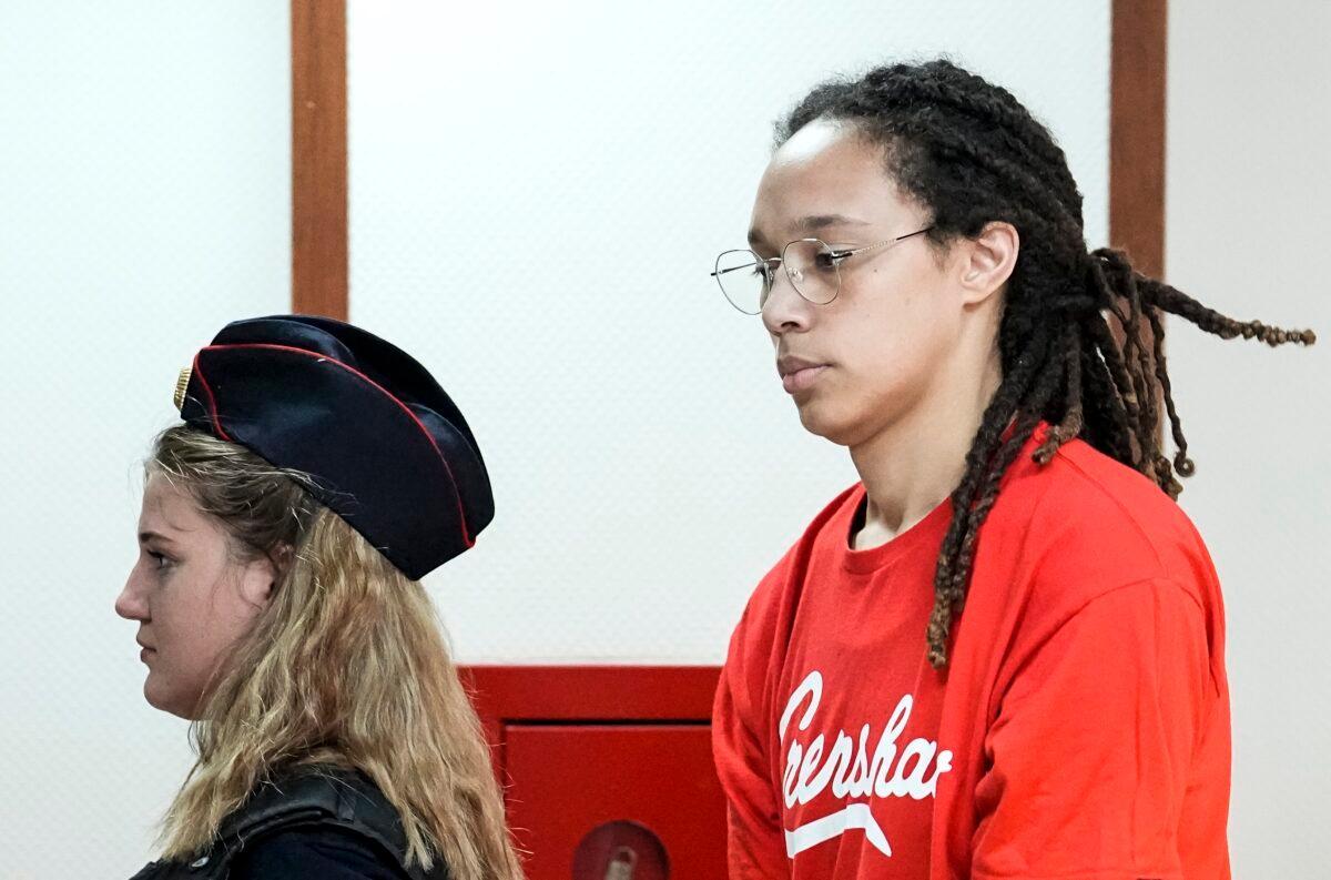 WNBA star and two-time Olympic gold medalist Brittney Griner is escorted to a courtroom for a hearing, in Khimki just outside Moscow, Russia, on July 7, 2022. (Alexander Zemlianichenko/AP Photo)