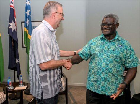 Australia's Prime Minister Anthony Albanese (L) greets Solomon Islands Prime Minister Manasseh Sogavare (R) during a bilateral meeting at the Pacific Islands Forum (PIF) in Suva, Fiji, on July 13, 2022. (Armao/Pool/AFP via Getty Images)