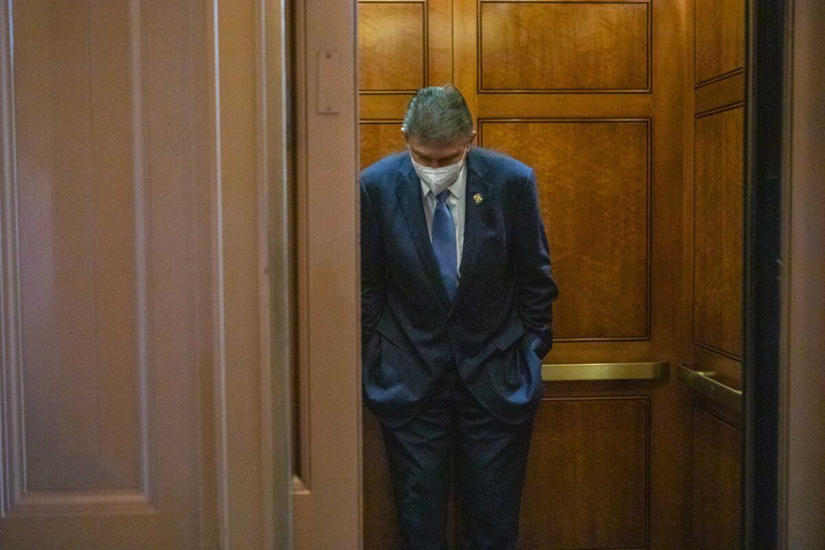 Sen. Joe Manchin (D-W. Va.) departs the Senate floor following a vote on Capitol Hill in Washington on Aug. 6, 2022. (Anna Rose Layden/Getty Images)