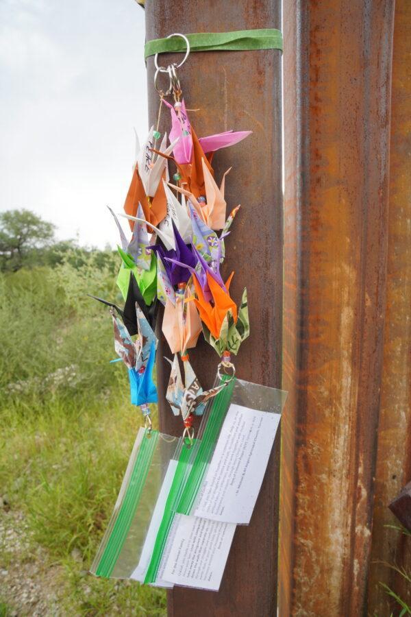 Origami puppets are left behind for undocumented children entering the United States through a breach in Arizona's border wall with Mexico on Aug. 24. (Allan Stein/The Epoch Times)