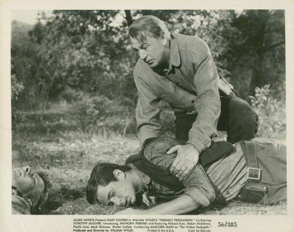 Anthony Perkins as oldest son of the Birdwell family, Josh (lying), is feared injured by Gary Cooper as Jess Birdwell, his father, in "Friendly Persuasion" about a Quaker family during the Civil War. (MovieStillsDB)