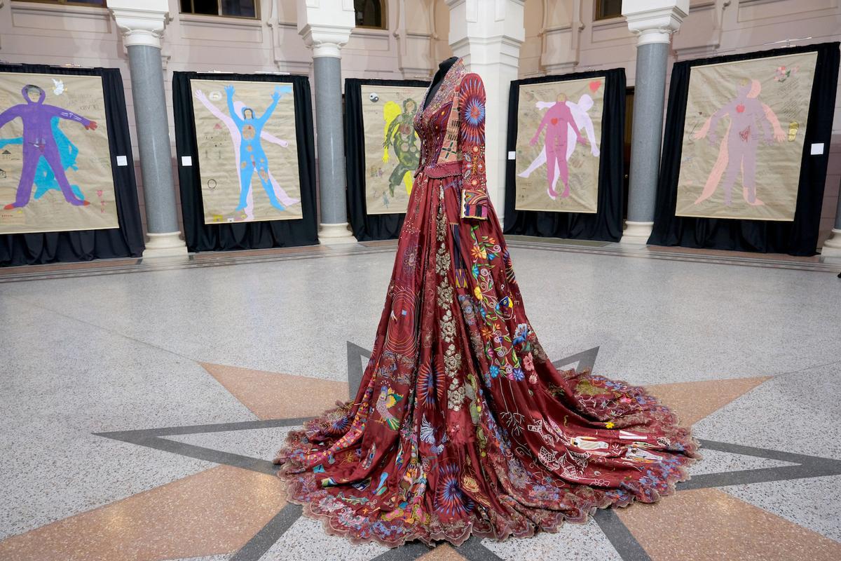 The Red Dress in Speaking Out in collaboration with War Childhood Museum Sarajevo. The exhibition was dedicated to and co-produced by women survivors of conflict-related sexual violence and children born of war. (Courtesy of <a href="https://www.instagram.com/thereddress_embroidery/">Kirstie Macleod</a>)