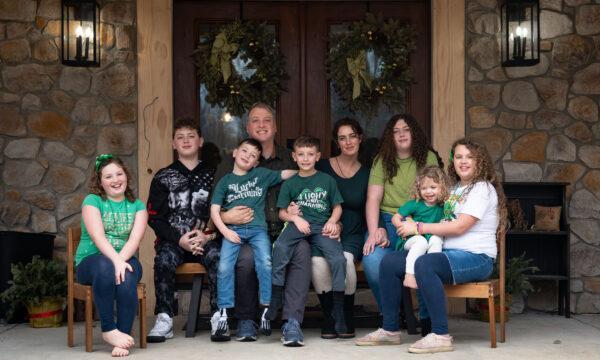 The Houck family (from left to right), Therese, Mark Jr., Augustine, Mark Houck, Joshua, Ryan-Marie, Ava, Imelda, and Kathryn at their home in Kintnersville, Pa., on March 17, 2023. (Samira Bouaou/The Epoch Times)