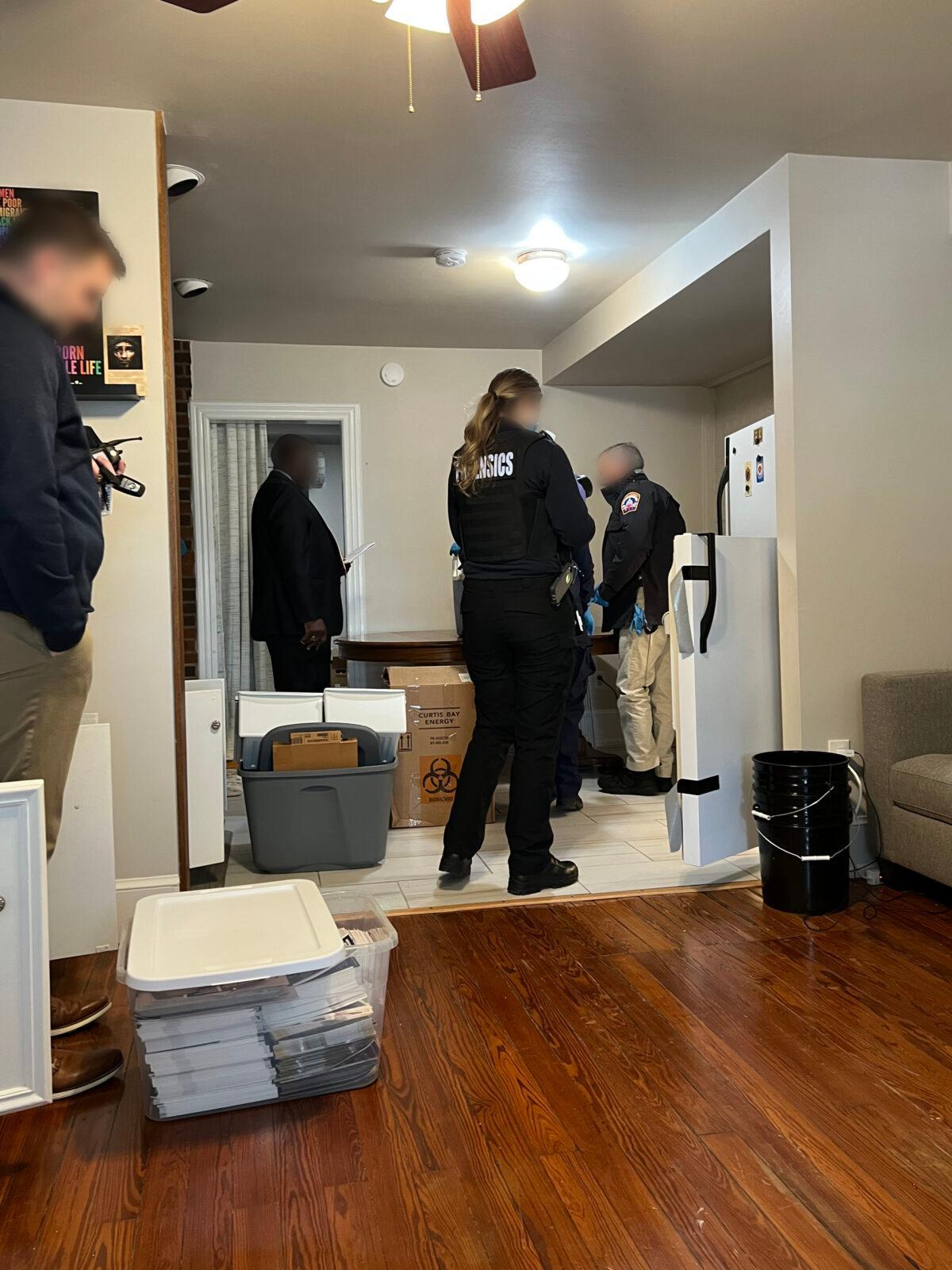 Police collect five infant bodies from Lauren Handy's apartment in Washington, DC on March 30, 2020. (Courtesy of Terrisa Bukovinac/Face blur by The Epoch Times)