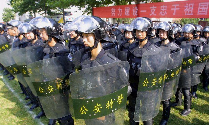 Dozens Injured as Police and Farmers Clash in China