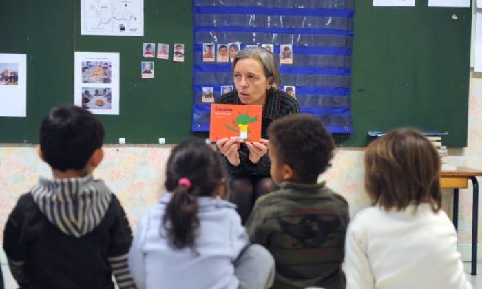 A teacher reads a book to her kindergarten class. (Eric Cabanis/AFP/Getty Images)