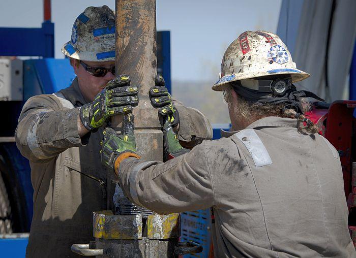 Workers change pipes at a gas drilling rig exploring the Marcellus Shale outside the town of Waynesburg, Pa. on April 13, 2012. (Mladen Antonov/AFP/Getty Images)
