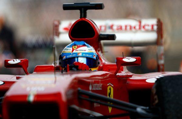 Fernando Alonso drives into parc ferme after winning the Chinese Formula One Grand Prix at the Shanghai International Circuit on April 14, 2013 in Shanghai, China. (Vladimir Rys/Getty Images)