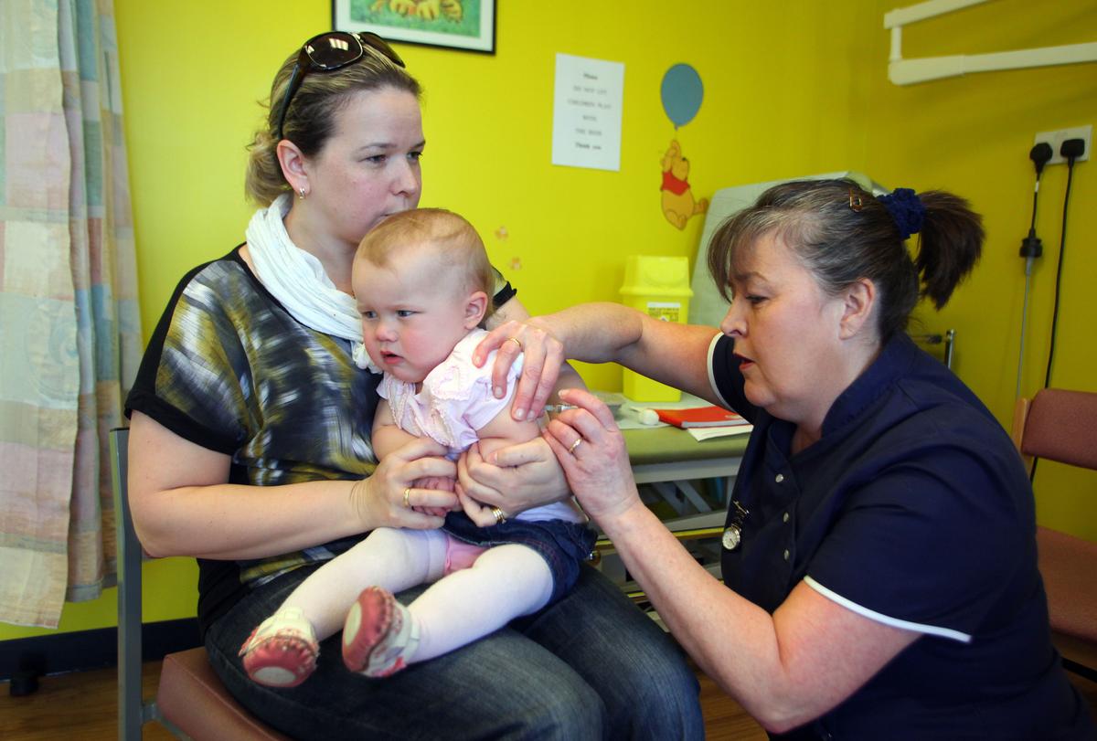 A 14-month-old receives the combined Measles Mumps and Rubella (MMR) vaccination at a drop-in clinic near Swansea in south Wales, as part of a vaccination drive. (Geoff Caddick/AFP/Getty Images)