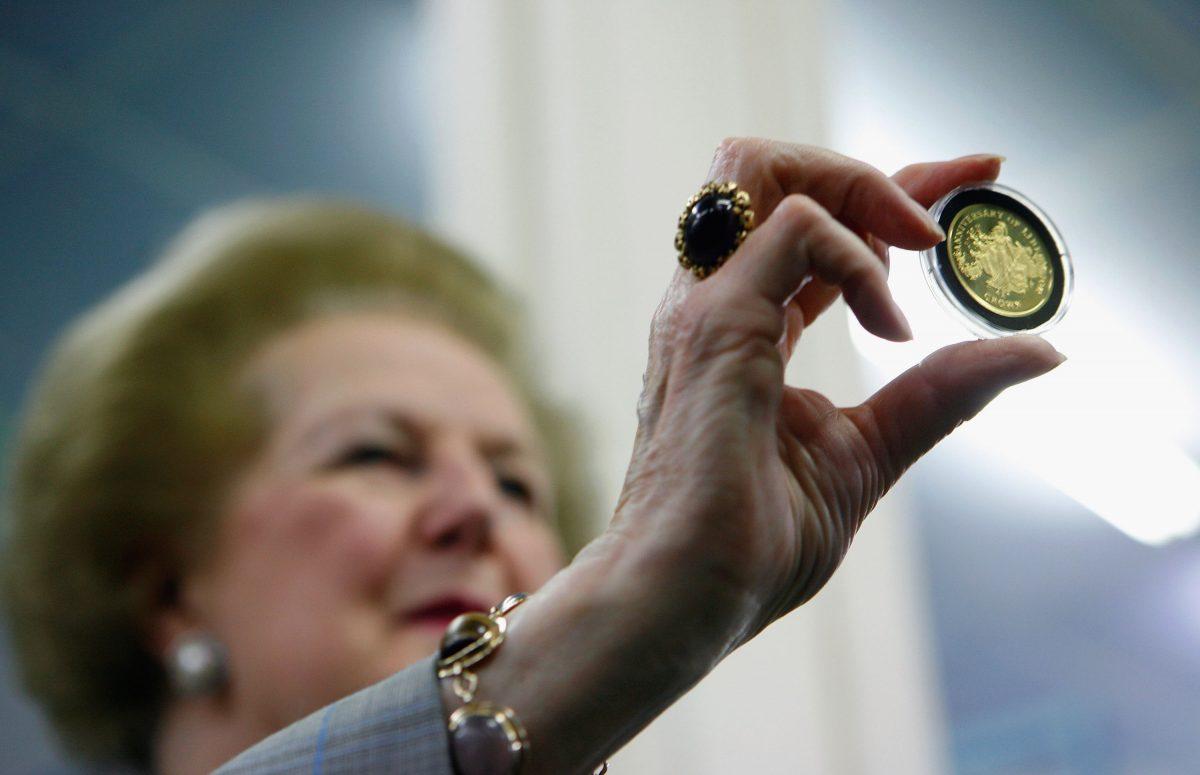 Baroness Margaret Thatcher holds a commemorative gold Falkland Islands 25th Anniversary Liberation coin at Pobjoy Mint on May 31, 2007, in London. (Daniel Berehulak/Getty Images)