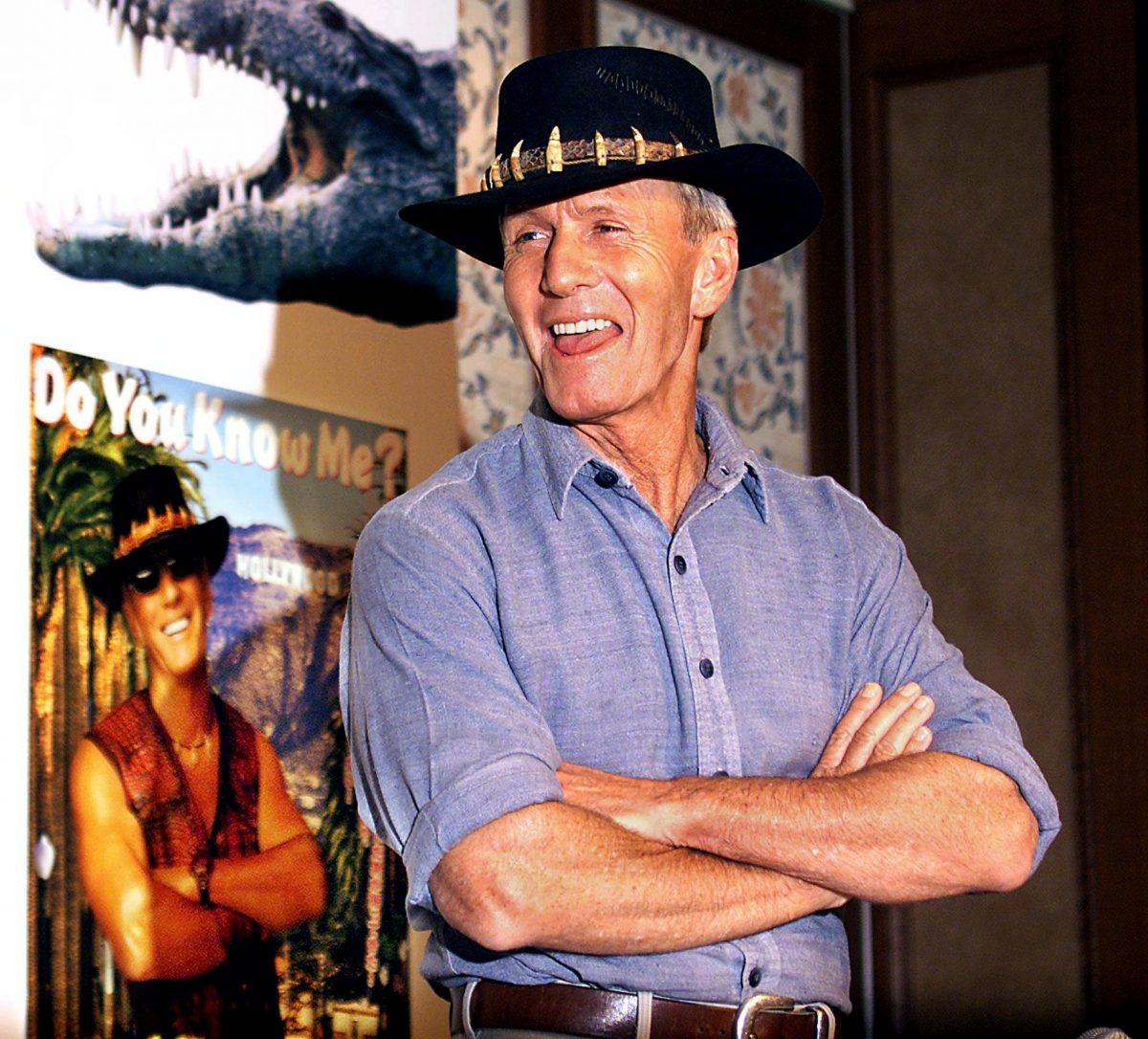 Australian actor Paul Hogan posing in front of a poster for his movie "Crocodile Dundee in Los Angels" at a Tokyo hotel on June 6, 2001. (Yoshikazu Tsuno/AFP/Getty Images)
