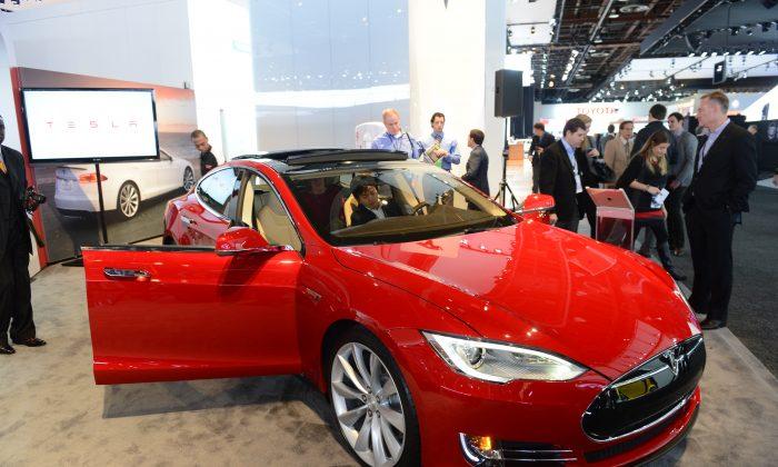 Tesla Stock Riding High but Risks Remain