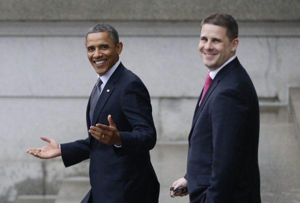 Then-President Barack Obama and then-White House senior adviser Dan Pfeiffer, right, react to a reporter's question as they leave the Treasury Department in Washington on Jan. 16, 2013. (Charles Dharapak, AP Photo)