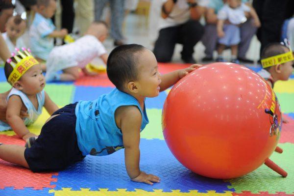 Chinese toddlers play at a Beijing nursery in 2009. Master of Business Administration preparatory classes for babies and toddlers have become popular in China among wealthy parents wanting to give their children a head start in education. (STR/AFP/Getty Images)