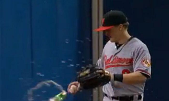 Nate McLouth Beer Catch: Fan Throws Beer at Outfielder During Fly Ball Catch