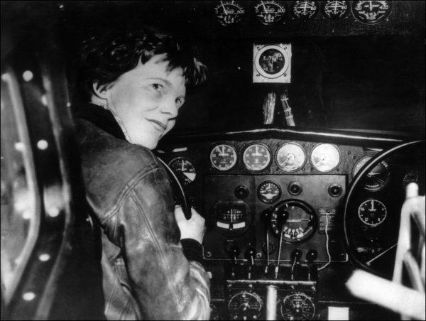 An undated picture taken in the 1930s shows American female aviator Amelia Earhart at the controls of her plane. (AFP/Getty Images)