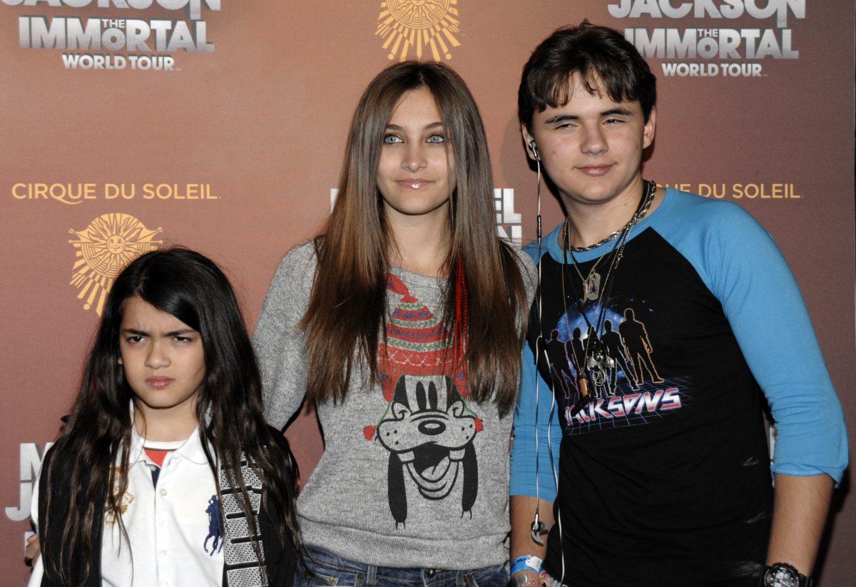 (L-R) Blanket Jackson, Paris Jackson, and Prince Michael Jackson at the opening night of the Michael Jackson The Immortal World Tour in Los Angeles, on Jan. 27, 2012. (AP Photo/Dan Steinberg)