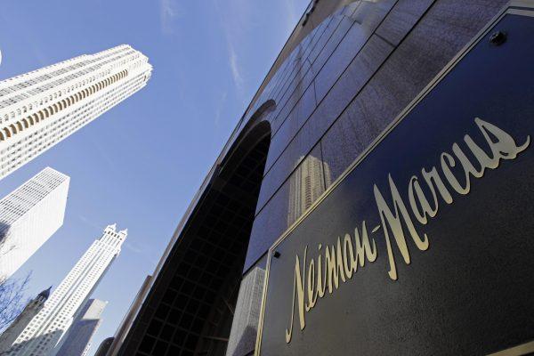 The Chicago skyline is reflected in the exterior of Neiman Marcus on Michigan Avenue in Chicago on March 11, 2009. (M. Spencer Green/AP)