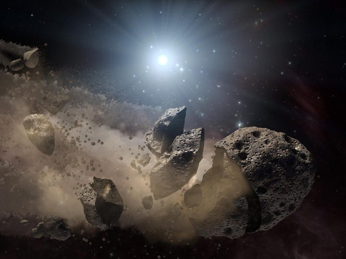 An asteroid breaks up in this artist's concept. (NASA)