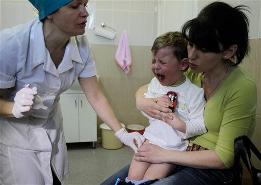 Many injuries that come from vaccines are long-term injuries but are often pushed out before these are discovered for expediency. (AP Photo/Sergei Chuzavkov)
