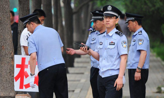 Beijing Resident: Police Framed and Tortured My Husband 