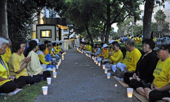Candlelight Vigil Brings 14 Years of Persecution to Light