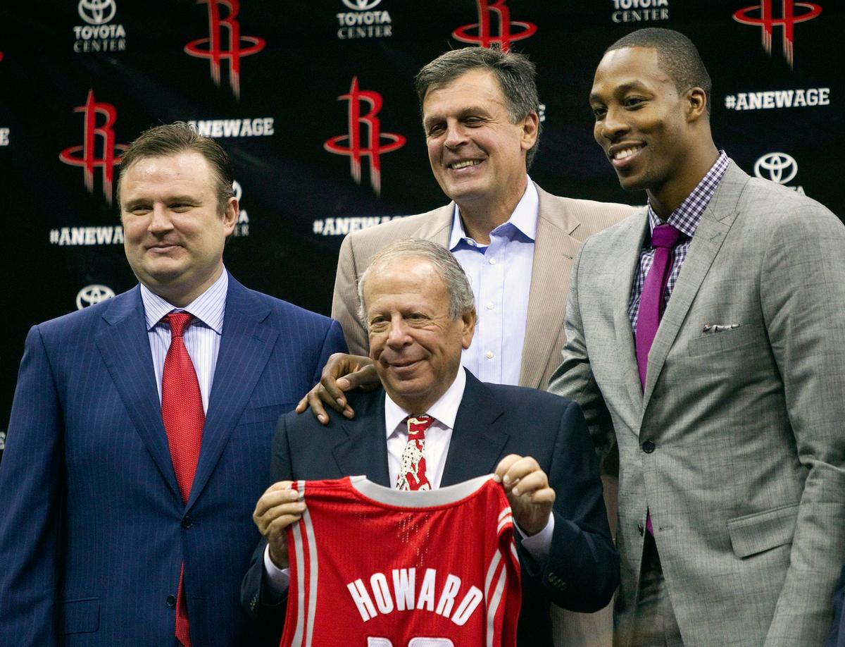 Dwight Howard (R) poses with Houston Rockets owner Les Alexander (2L), Houston Rockets general manager Daryl Morey (L) and Houston Rockets head coach Kevin McHale after being introduced as the newest Houston Rocket at Toyota Center in Houston, Texas on July 13, 2013. (Bob Levey/Getty Images)