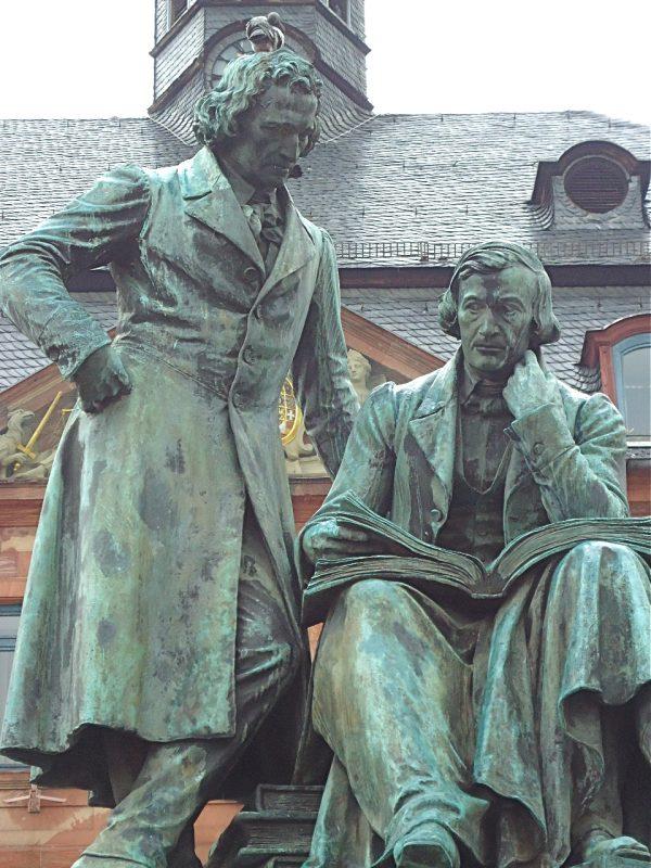 A 19th-century bronze statue of the Brothers Grimm in Hanau marks the beginning of Germany’s Fairy Tale Road. (Susan James)