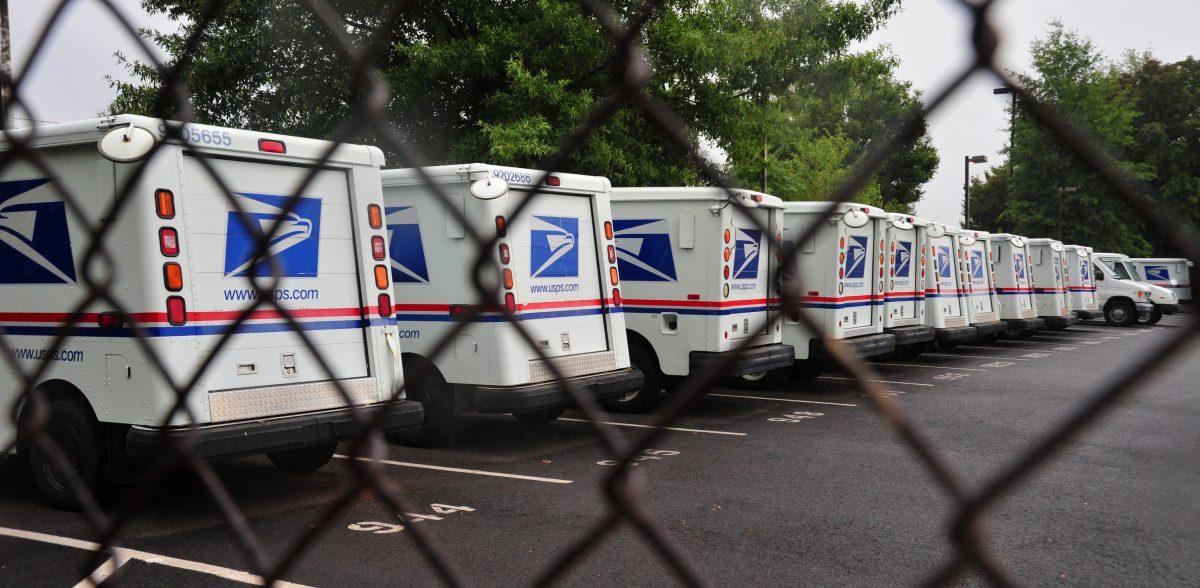U.S. Postal Service mail delivery trucks sit idle at the Manassas Post Office in this file photo. (Karen Bleier/AFP/Getty Images)