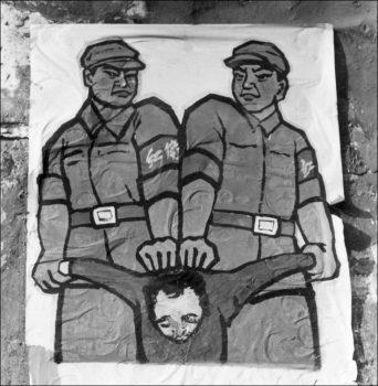 A poster displayed in late 1966 in a Beijing street shows how to deal with a so-called "enemy of the people" during the Great Proletarian Cultural Revolution. (Jean Vincent/AFP/Getty Images)
