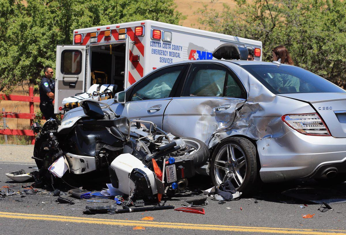 The aftermath of an accident remains in the road after a California Highway Patrol motorcycle officer collided with a car in Brentwood, Calif., on May 18, 2013. (Doug Pensinger/Getty Images)