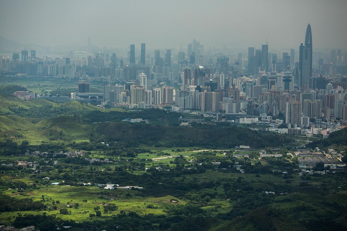 Shenzhen is seen from Hong Kong in this file photo, July 11, 2013. Shenzhen enjoyed a period of good times when policies were specially set for this city alone. But since all of China opened to the world, Shenzhen has been marginalized and become a second-tier city. (Lam Yik Fei/Getty Images)