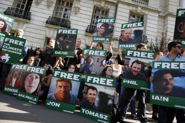 Greenpeace activists, demanding the release of the so-called Arctic 30, protest in front of the Russian embassy in Paris, on Sep. 27, 2013. (Thomas SamsonAFP/Getty Images)