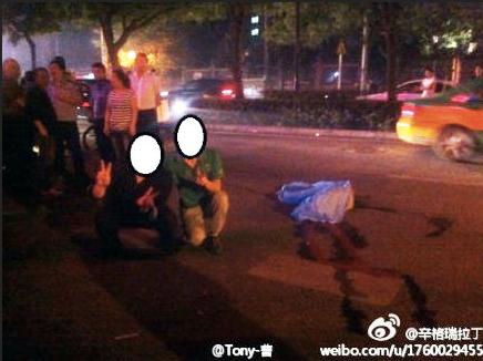 Drunken Chinese Pose for Photo Next to Dead Body