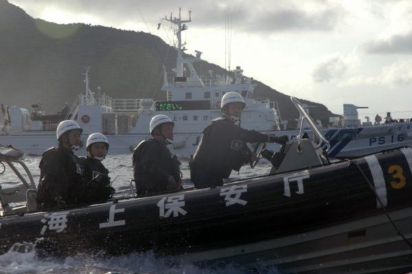 Japanese Coast Guard ships are shown near the Senkaku islands, also called the Diaoyu islands. Territorial disputes between China and Japan over the islands are growing more tense. (AP Photo/Emily Wang)