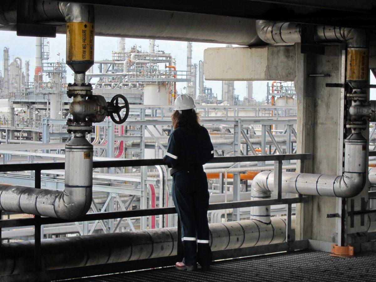 An employee of French oil company Total gathers information on the company's Texan plant in Port Arthur in June 2022.  (Marc Preel/AFP/Getty Images)