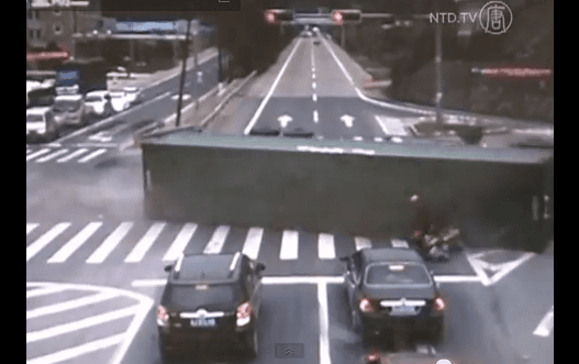 Motorcyclist Narrowly Escapes Overturning Truck in China (Video)