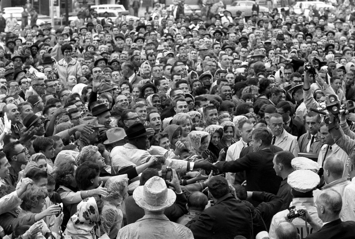 President Kennedy reaches out to the crowd gathered at the Hotel Texas Parking Lot Rally in Fort Worth, Texas, on Nov. 22, 1963. (Cecil Stoughton. White House Photographs. John F. Kennedy Presidential Library and Museum, Boston)