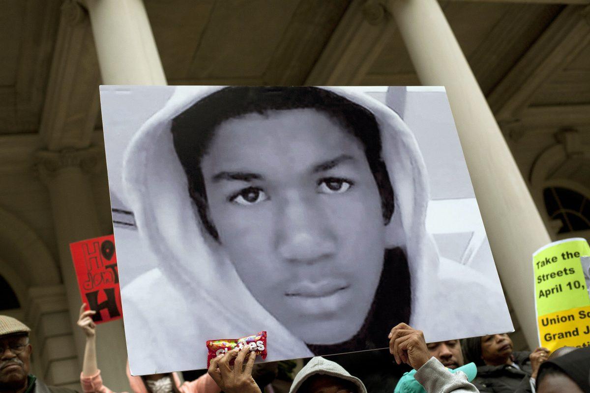 A picture of 17-year-old Trayvon Martin is seen during a protest in this March 2012 file photo. (Allison Joyce/Getty Images)