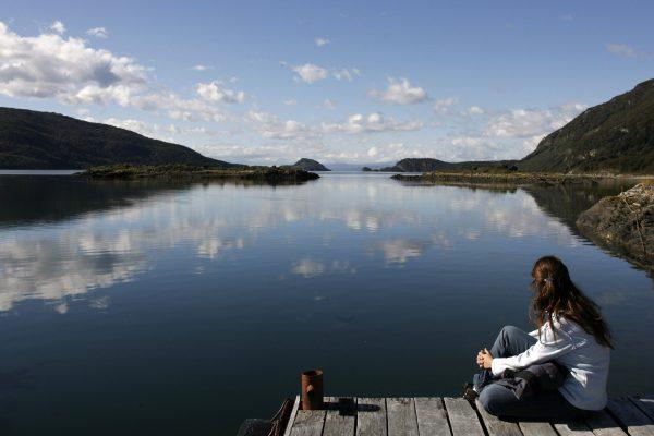 A tourist looks out at the Lapataia Bay in the Tierra del Fuego National Park, located near Ushuaia, Argentina, on March 31, 2007. (Juan Mabromata/AFP/Getty Images)