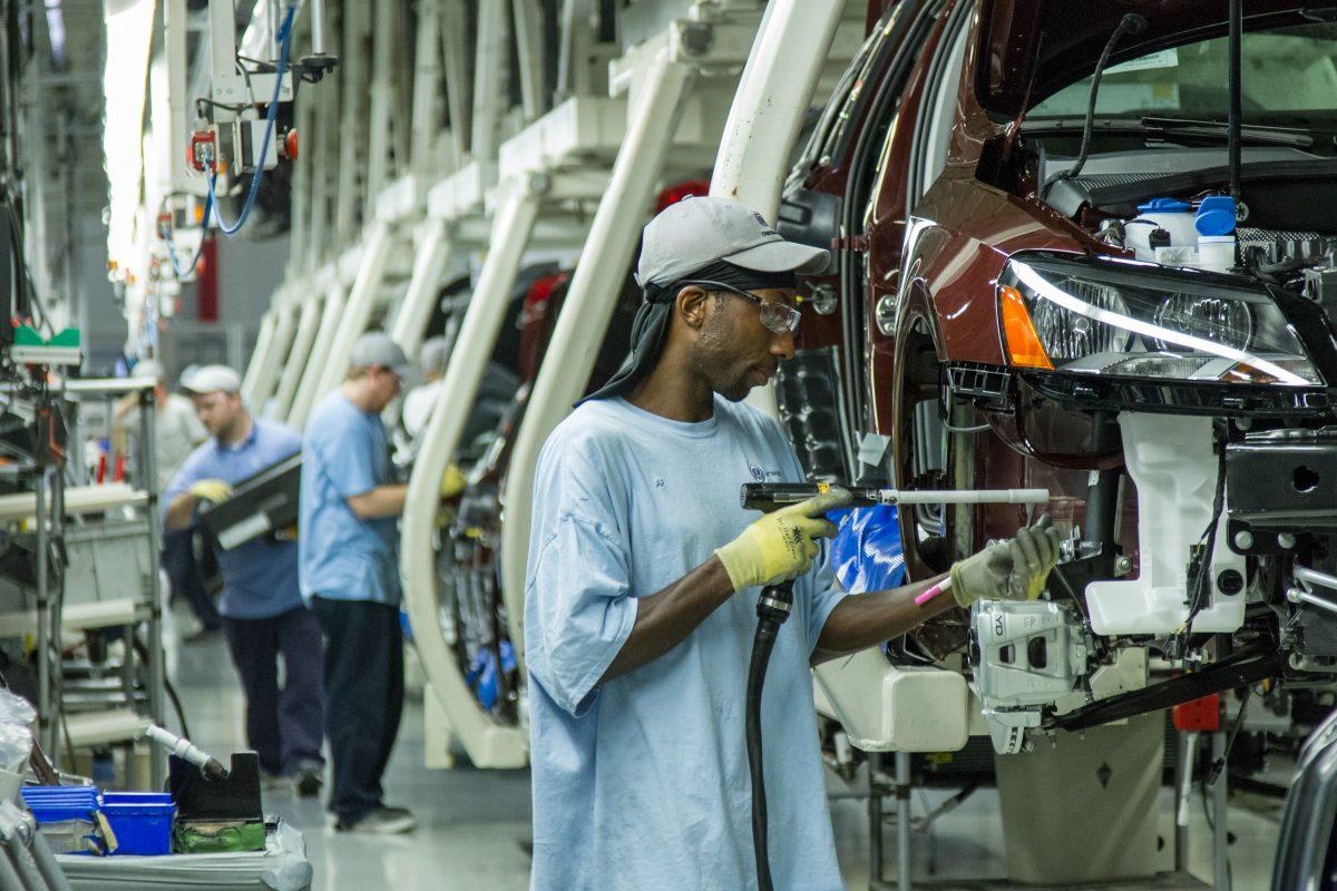 Workers assemble Volkswagen Passat sedans at the German automaker's plant in Chattanooga, Tenn., June 12, 2013. (AP Photo/ Erik Schelzig, file)