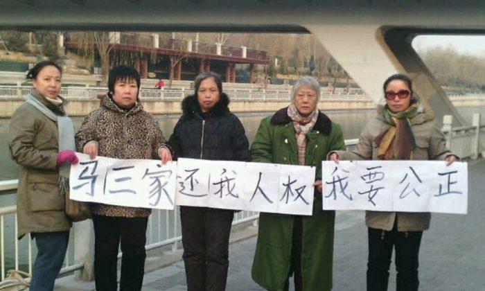 China Camp Closures Prompt Calls for Compensation
